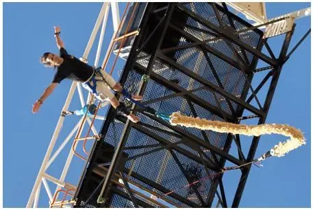 Man with bungee made of condoms.